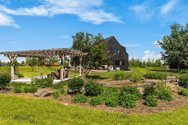 7980 Balsam, Bozeman, MT 59718 - view of community featuring a yard, a garden, a pergola, and a patio