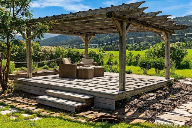 7980 Balsam, Bozeman, MT 59718 - wooden deck featuring a pergola and a mountain view