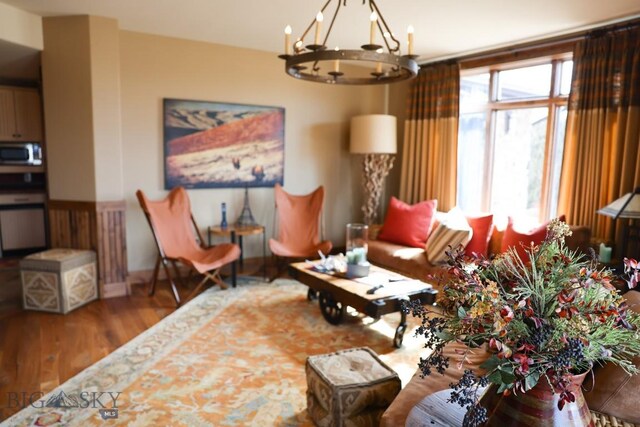 201 Cotton Willow, Melrose, MT 59743 - living room with a chandelier and wood finished floors