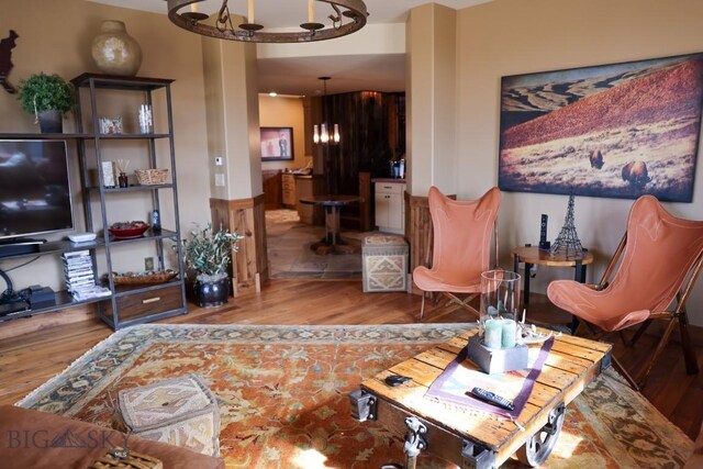 201 Cotton Willow, Melrose, MT 59743 - living room featuring a chandelier and wood finished floors