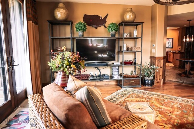 201 Cotton Willow, Melrose, MT 59743 - living room featuring wood finished floors and a chandelier