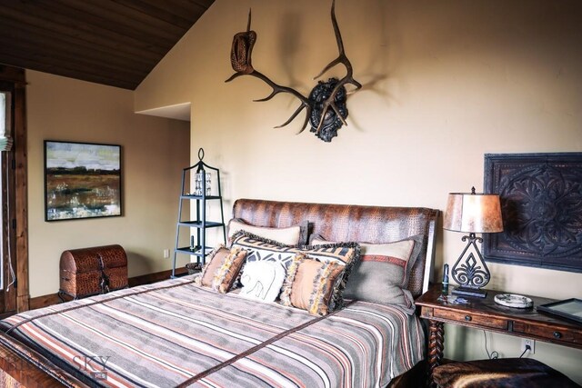 201 Cotton Willow, Melrose, MT 59743 - bedroom with vaulted ceiling, wood ceiling, and baseboards