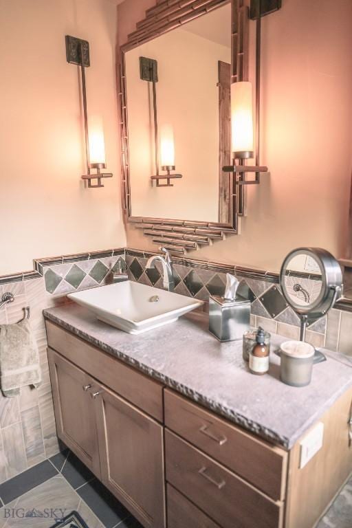 201 Cotton Willow, Melrose, MT 59743 - bathroom with vanity, tile walls, and tile patterned floors