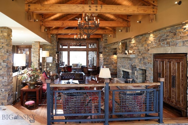 201 Cotton Willow, Melrose, MT 59743 - living room featuring wood finished floors, a chandelier, high vaulted ceiling, a fireplace, and wooden ceiling with exposed beams