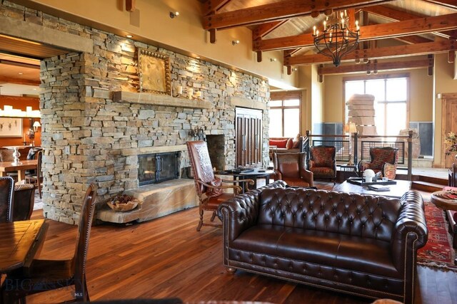 201 Cotton Willow, Melrose, MT 59743 - living room with a fireplace, hardwood / wood-style floors, beam ceiling, high vaulted ceiling, and a chandelier