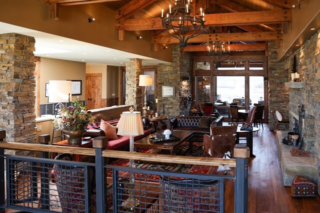 201 Cotton Willow, Melrose, MT 59743 - living area with a chandelier, hardwood / wood-style flooring, beam ceiling, and high vaulted ceiling