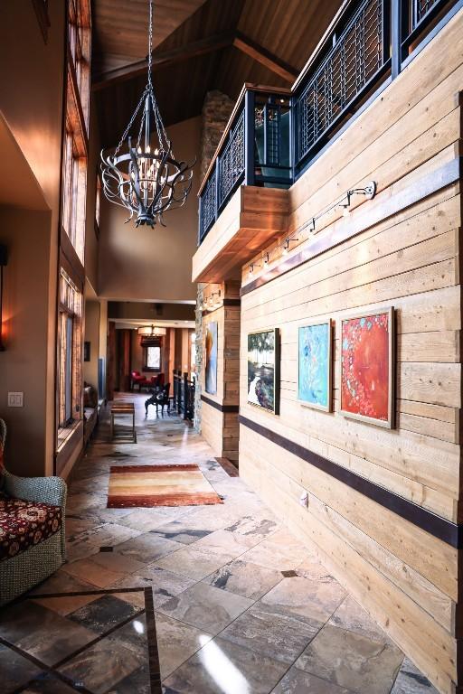 201 Cotton Willow, Melrose, MT 59743 - community lobby featuring high vaulted ceiling, wood walls, and wooden ceiling