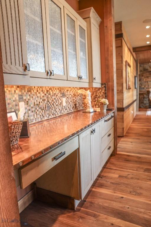 201 Cotton Willow, Melrose, MT 59743 - kitchen with stainless steel dishwasher, wood finished floors, tasteful backsplash, glass insert cabinets, and recessed lighting