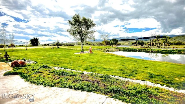 201 Cotton Willow, Melrose, MT 59743 - view of home's community with a water and mountain view and a yard
