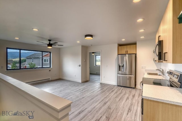 1104 Ridgeview Trl, Livingston, MT 59047 - kitchen featuring appliances with stainless steel finishes, recessed lighting, light wood-style floors, baseboard heating, and a ceiling fan