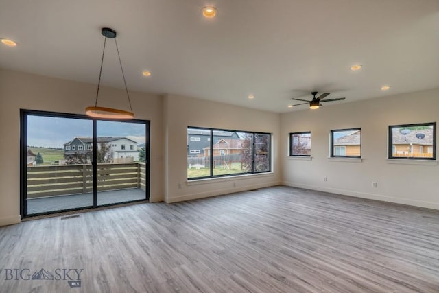 1104 Ridgeview Trl, Livingston, MT 59047 - unfurnished living room featuring wood finished floors, ceiling fan, and recessed lighting
