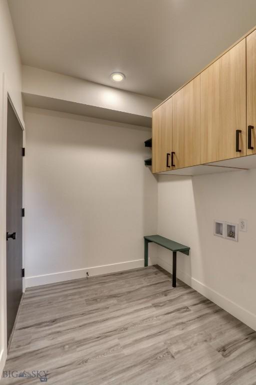 1104 Ridgeview Trl, Livingston, MT 59047 - laundry area featuring cabinet space, washer hookup, recessed lighting, and light wood-style flooring