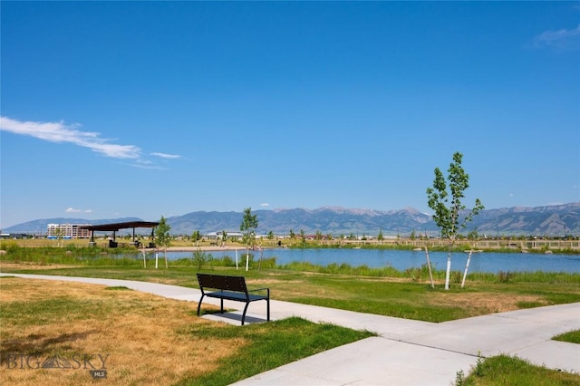 602 Mira Way Unit A, Belgrade, MT 59714 - view of community with a lawn and a water and mountain view