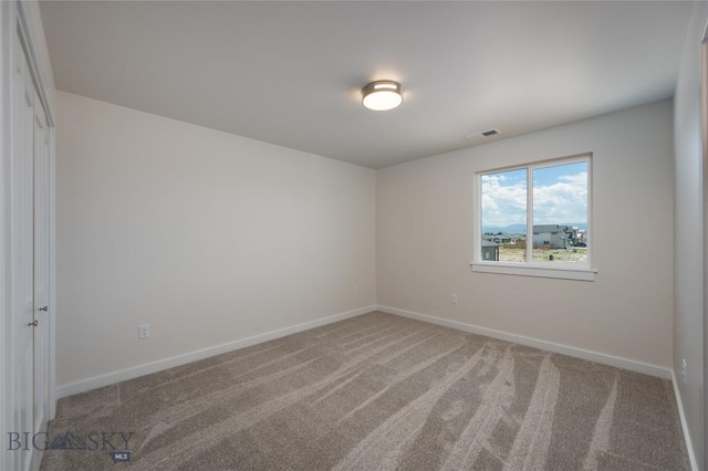 602 Mira Way Unit A, Belgrade, MT 59714 - unfurnished room featuring light carpet and baseboards