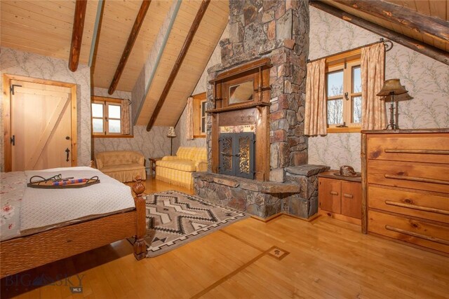 31255 Ninemile Rd, Huson, MT 59846 - bedroom with wallpapered walls, wood ceiling, and wood finished floors