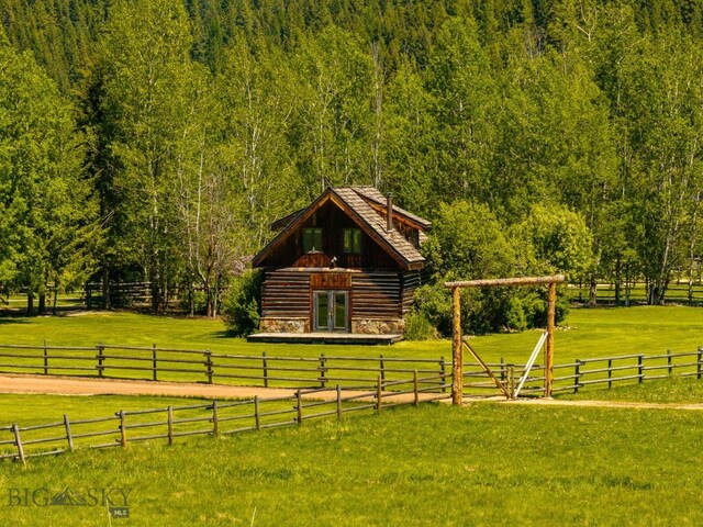 31255 Ninemile Rd, Huson, MT 59846 - view of yard with a wooded view and french doors