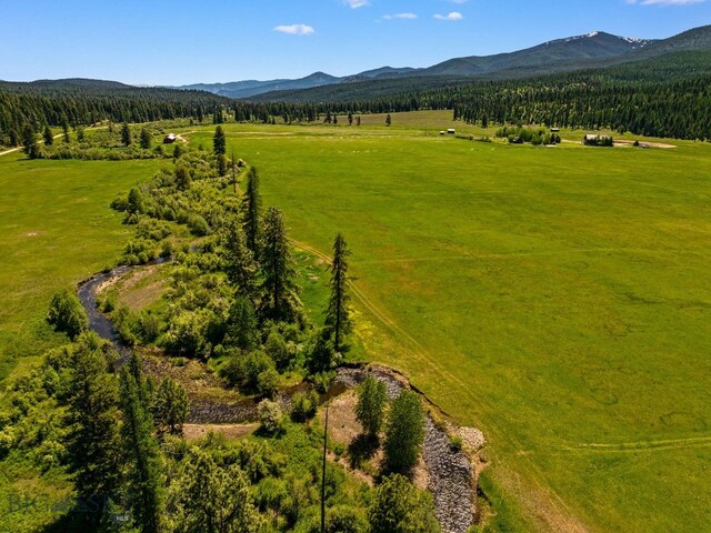 31255 Ninemile Rd, Huson, MT 59846 - aerial view of sparsely populated area with a mountainous background and a heavily wooded area