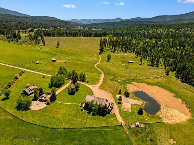 31255 Ninemile Rd, Huson, MT 59846 - aerial view of sparsely populated area with a mountainous background and a heavily wooded area