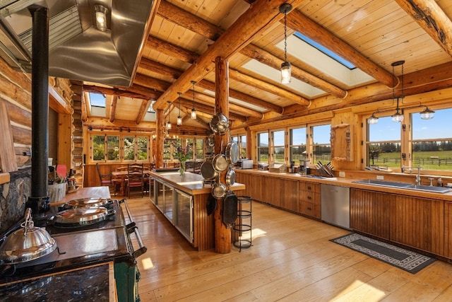 31255 Ninemile Rd, Huson, MT 59846 - sunroom with a sink, plenty of natural light, a skylight, and a wood stove