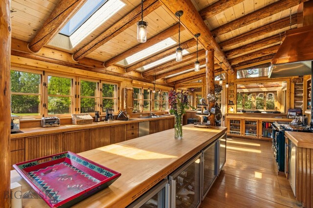 31255 Ninemile Rd, Huson, MT 59846 - sunroom / solarium featuring wine cooler, a skylight, french doors, and a sink