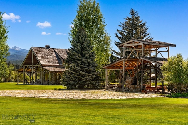 31255 Ninemile Rd, Huson, MT 59846 - surrounding community featuring a gazebo, a yard, and a mountain view