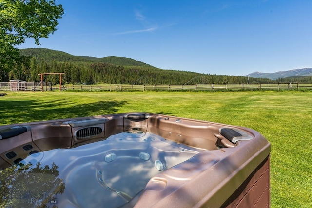 31255 Ninemile Rd, Huson, MT 59846 - view of yard with a view of countryside, a mountain view, a hot tub, and a forest view