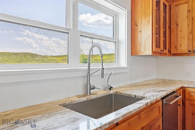 49 Wild Rye Pl, Three Forks, MT 59752 - kitchen featuring brown cabinets, dishwasher, and light stone counters