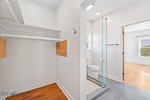 49 Wild Rye Pl, Three Forks, MT 59752 - bathroom with a shower stall and wood finished floors