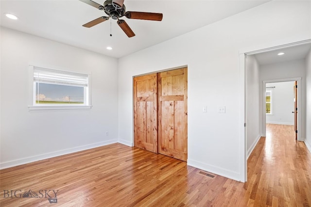 49 Wild Rye Pl, Three Forks, MT 59752 - unfurnished bedroom with light wood-style floors, recessed lighting, ceiling fan, and a closet