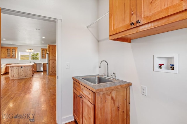 49 Wild Rye Pl, Three Forks, MT 59752 - washroom featuring washer hookup, cabinet space, light wood-style floors, and recessed lighting