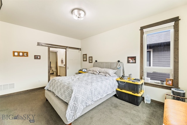 104 Albrey Trl Unit C, Bozeman, MT 59718 - carpeted bedroom with a barn door and baseboards