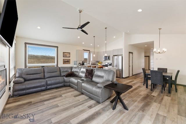104 Albrey Trl Unit C, Bozeman, MT 59718 - living room featuring a ceiling fan, recessed lighting, a chandelier, light wood-style floors, and high vaulted ceiling