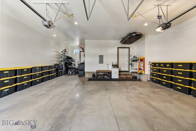 104 Albrey Trl Unit C, Bozeman, MT 59718 - garage with electric panel, a garage door opener, and recessed lighting