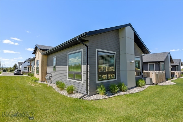 104 Albrey Trl Unit C, Bozeman, MT 59718 - view of side of home featuring a lawn