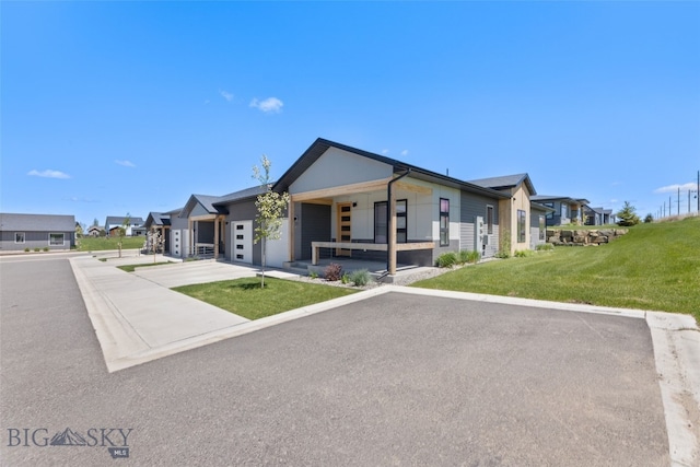 104 Albrey Trl Unit C, Bozeman, MT 59718 - view of front of property with a front lawn, covered porch, and a residential view