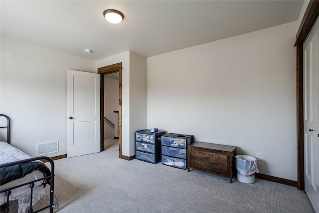 bedroom with visible vents, baseboards, and carpet floors