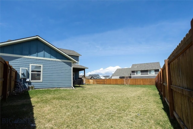 view of yard with a fenced backyard