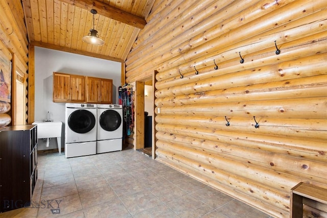 480 Moose Crossing Rd, Gallatin Gateway, MT 59730 - laundry area with washer and clothes dryer, cabinet space, log walls, wood ceiling, and a towering ceiling