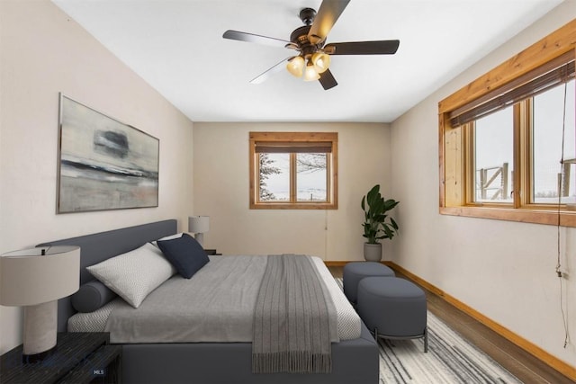 480 Moose Crossing Rd, Gallatin Gateway, MT 59730 - bedroom with wood finished floors and a ceiling fan