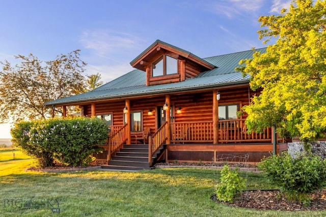 480 Moose Crossing Rd, Gallatin Gateway, MT 59730 - cabin featuring covered porch, a front yard, and log exterior