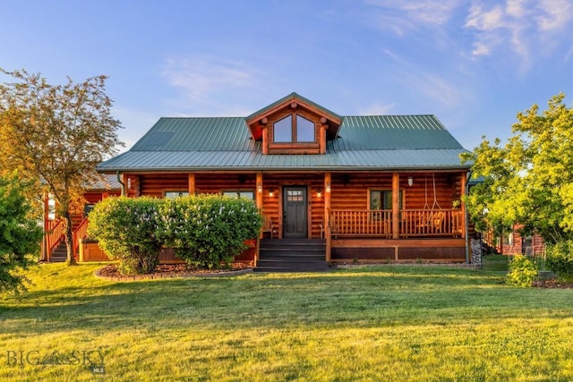 480 Moose Crossing Rd, Gallatin Gateway, MT 59730 - log-style house featuring a porch, a front lawn, and a metal roof