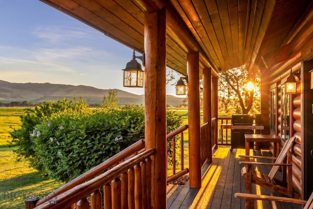 480 Moose Crossing Rd, Gallatin Gateway, MT 59730 - wooden porch with a mountain view and a grill