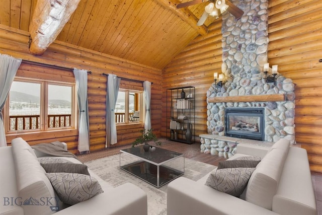 480 Moose Crossing Rd, Gallatin Gateway, MT 59730 - living room featuring wood ceiling, ceiling fan, wood finished floors, rustic walls, and a stone fireplace