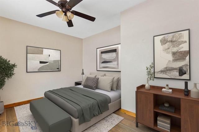 480 Moose Crossing Rd, Gallatin Gateway, MT 59730 - bedroom with wood finished floors and a ceiling fan