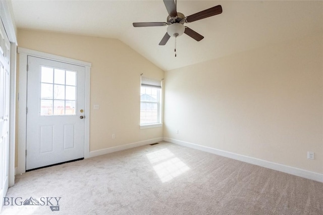 2300 Sturnella Ln, Belgrade, MT 59714 - empty room with lofted ceiling, light colored carpet, a ceiling fan, and baseboards