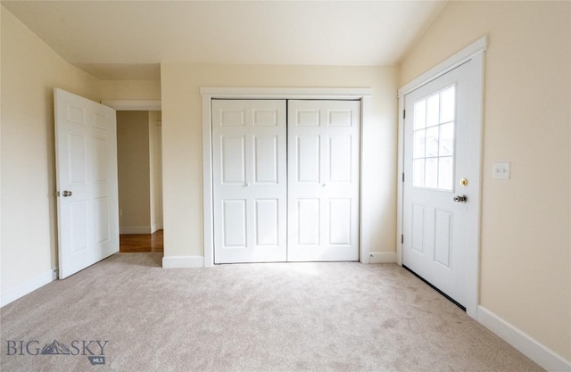 2300 Sturnella Ln, Belgrade, MT 59714 - unfurnished bedroom with carpet floors, a closet, and baseboards