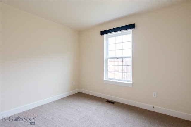2300 Sturnella Ln, Belgrade, MT 59714 - carpeted empty room featuring plenty of natural light and baseboards