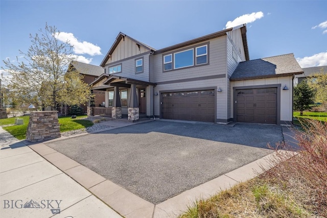 2026 Southbridge, Bozeman, MT 59718 - craftsman house with board and batten siding, a porch, driveway, and an attached garage