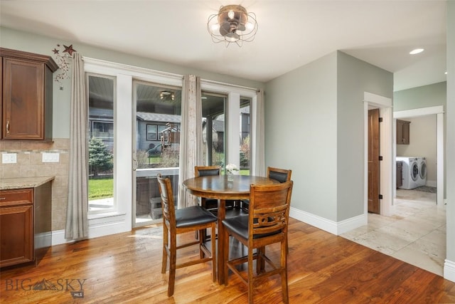 2026 Southbridge, Bozeman, MT 59718 - dining space featuring washer and dryer, light wood-style floors, healthy amount of natural light, and baseboards