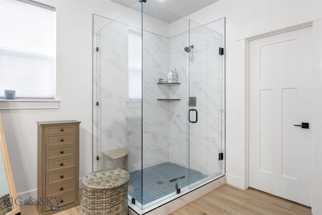 1502 Cyril Way, Belgrade, MT 59714 - bathroom featuring a stall shower and wood finished floors
